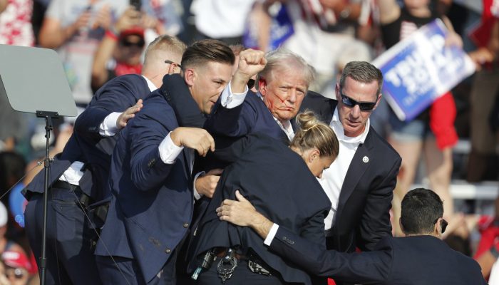 epa11476746 Former US President Donald Trump is rushed off stage by secret service after an incident during a campaign rally at the Butler Farm Show Inc. in Butler, Pennsylvania, USA, 13 July 2024.  EPA-EFE/DAVID MAXWELL