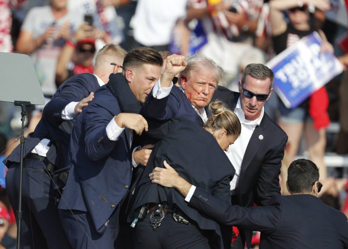 epa11476746 Former US President Donald Trump is rushed off stage by secret service after an incident during a campaign rally at the Butler Farm Show Inc. in Butler, Pennsylvania, USA, 13 July 2024.  EPA-EFE/DAVID MAXWELL