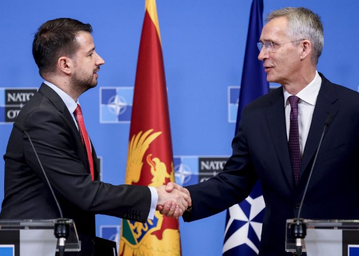 NATO Secretary General Jens Stoltenberg (R) and President of Montenegro, Jakov Milatovic shake hands at the end of a joint statement at the NATO headquarters in Brussels on June 22, 2023. (Photo by Kenzo TRIBOUILLARD / AFP)