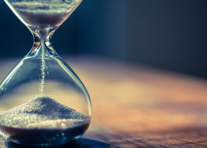 Sand,Running,Through,The,Bulbs,Of,An,Hourglass,Measuring,The