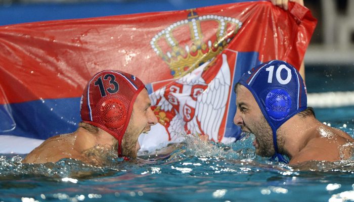 epa04333313 Branislav Mitrovic (L) and Filip Filipovic of Serbia celebrate with a Serbian flag after they defeated Hungary in the men's final of European Water Polo Championships in Hajos Alfred Swimming Pool in Budapest, Hungary, 27 July 2014.  EPA/Tamas Kovacs