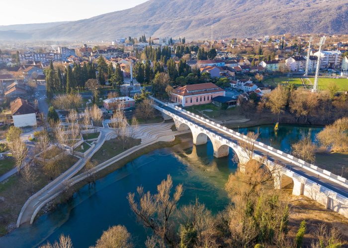 Danilovgrad Montenegro: bridge on Zeta river on the way to Ostrog monastery and the downtown park. Aerial view of the small town in Bjelopavlici.